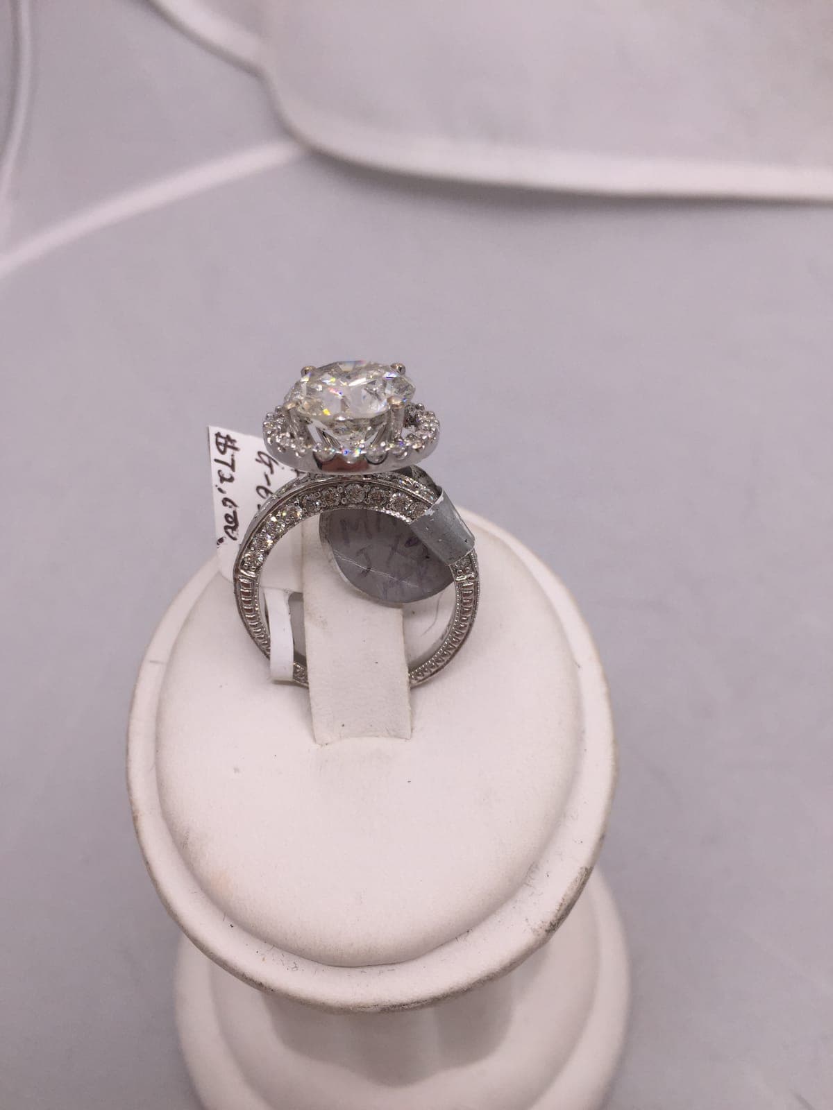 Diamond Halo Solitaire Engagement Ring — $72,600